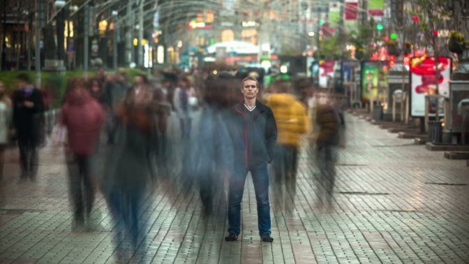 man_standing_in_crowd